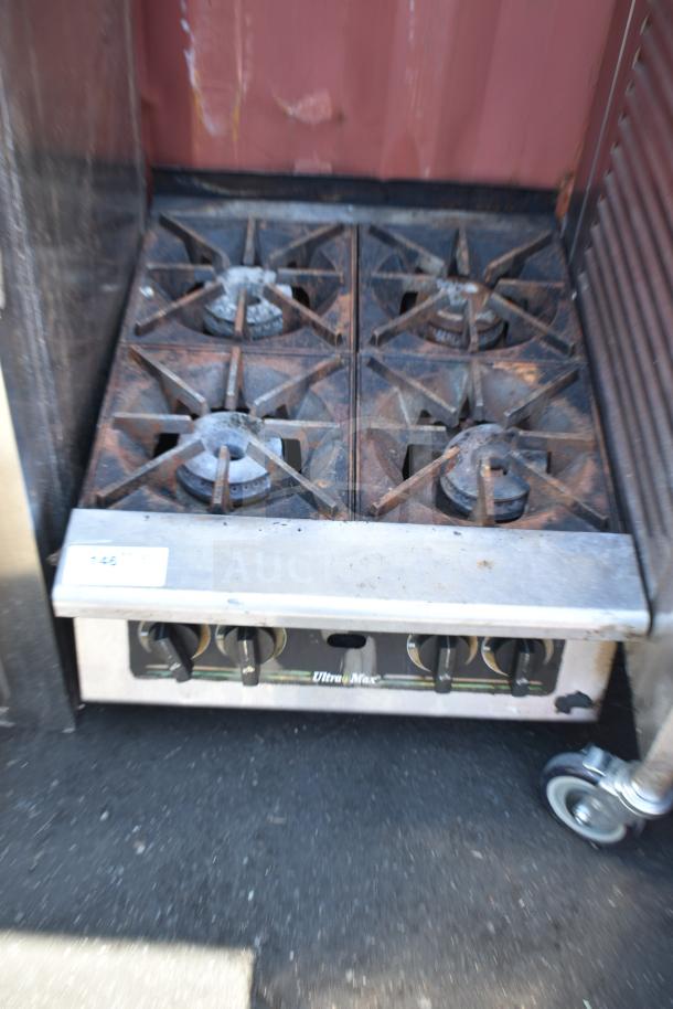 Star Max commercial countertop 4-burner gas range, used condition, visible wear, metal knobs, model marked "Ultra Max."