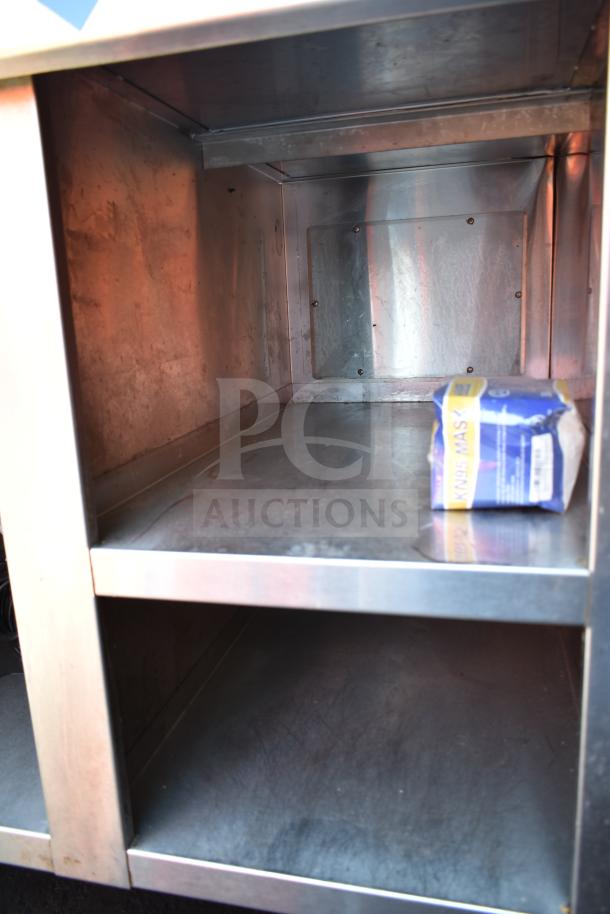 Commercial work station featuring Alto Shaam 200-CW cold pan drop-in and 2 round steam wells, stainless steel construction.