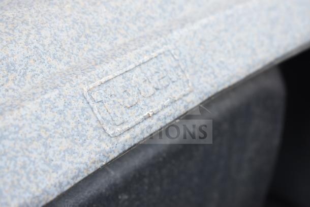 Gray Poly trash can with speckled texture, embossed logo highlighting brand. Auction includes four identical cans.