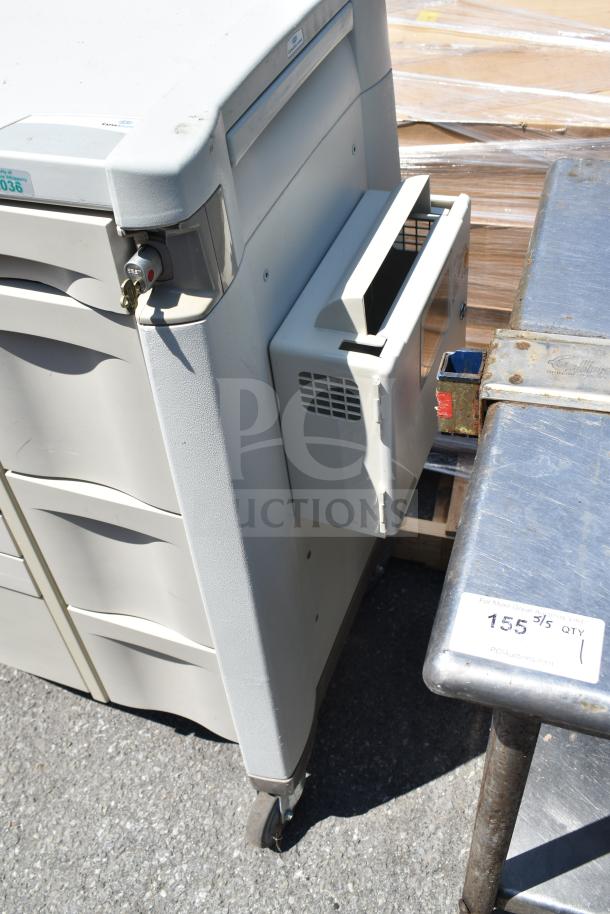 Capsa Solutions XL2097599 cart on casters, used condition, three secure drawers, lock mechanism, and attached side unit.