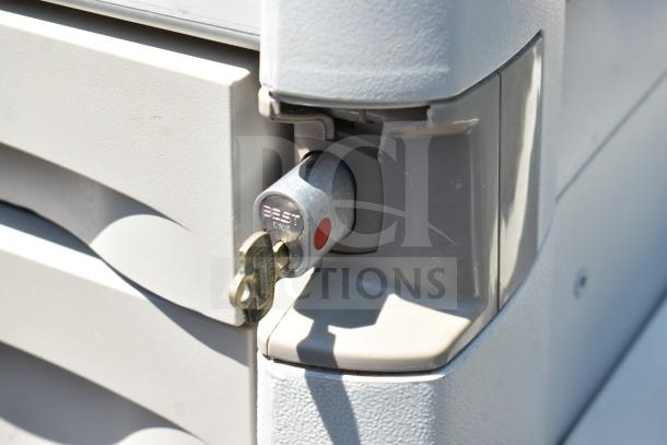 Capsa Solutions XL2097599 cart with a Best lock and key, commercial casters, durable gray finish, minor wear visible.