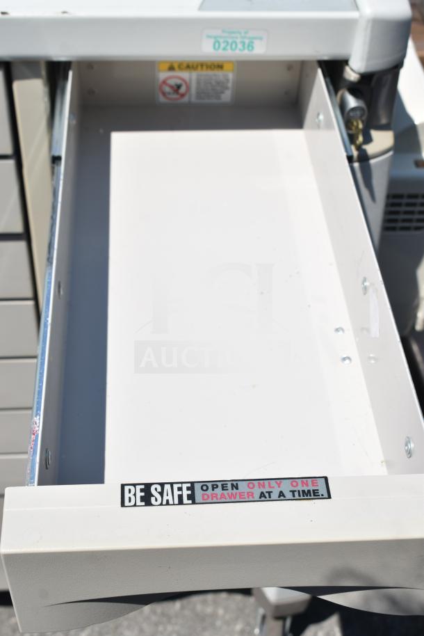 Capsa Solutions XL2097599 cart on commercial casters, open drawer with safety label. Excellent condition.