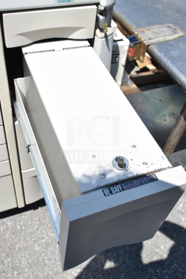 Capsa Solutions XL2097599 cart with commercial casters, featuring a lockable drawer in good condition with "Be Safe" label.