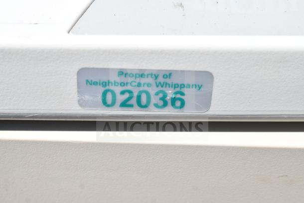 Capsa Solutions XL2097599 cart with commercial casters. Label indicates property of NeighborCare Whippany, marked "02036."