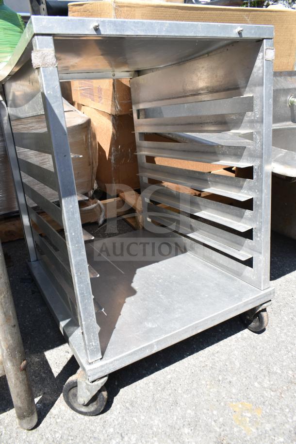 Commercial pan transport rack with multiple slots, sturdy metal construction, on durable commercial casters, lightly used.