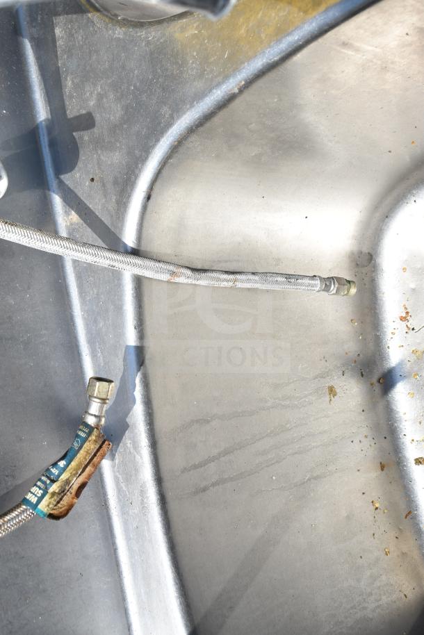 Commercial 3 bay sink, stainless steel, no legs, includes attached hoses, some surface marks, suitable for wash stations.