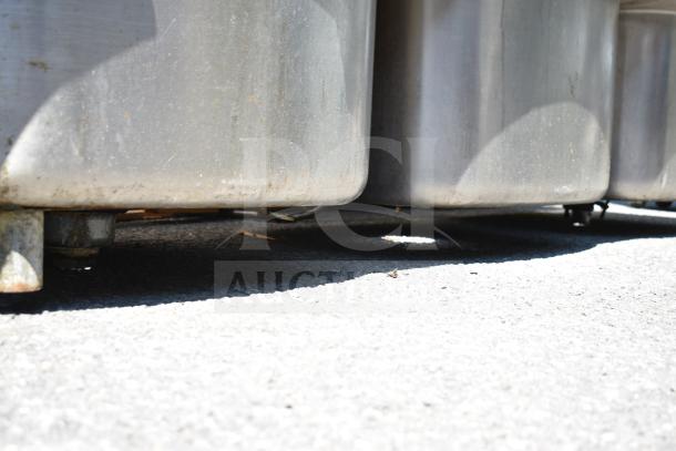 Commercial 3 bay sink without legs, stainless steel, used condition. Ideal for restaurant kitchens.