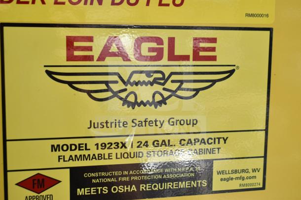 Brand new Eagle 24-gallon yellow flammable liquid safety cabinet, model 1923X, manual-closing door, slight scratches.