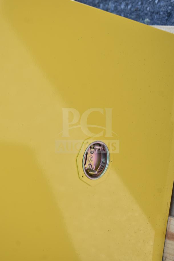 Brand new Eagle 24-gallon yellow flammable liquid safety cabinet, model 1923X, with manual-closing door, minor scratches.