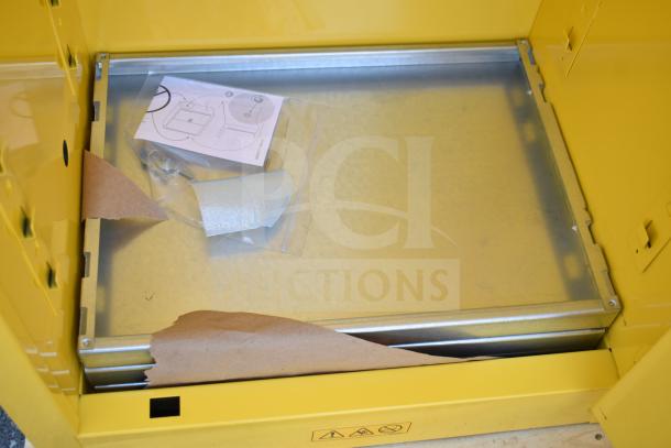 Brand new Eagle 24-gallon yellow flammable liquid safety cabinet, model 1923X, with manual-closing door. Scratches visible.