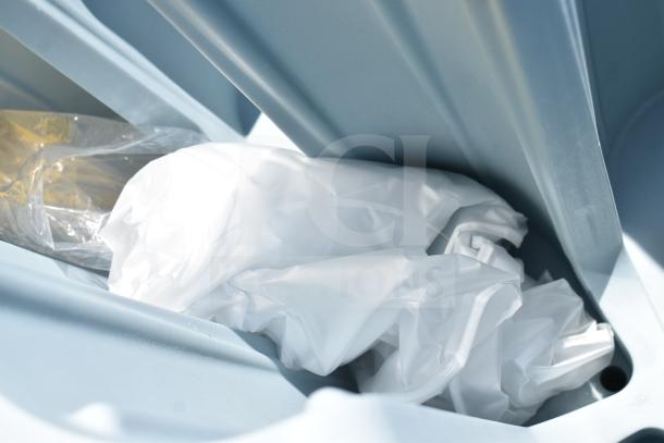 Brand new Metro POD dish cart, scratch and dent condition, with commercial casters, shown partially wrapped in packaging.