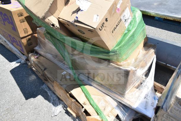 Pallet with new boxed items, including hand sink and cafe barstool, labeled "FRAGILE," partially wrapped in green film.