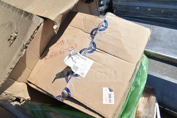 Cardboard boxes labeled "Sink Register" with visible shipping labels; part of six new scratch and dent items for auction.