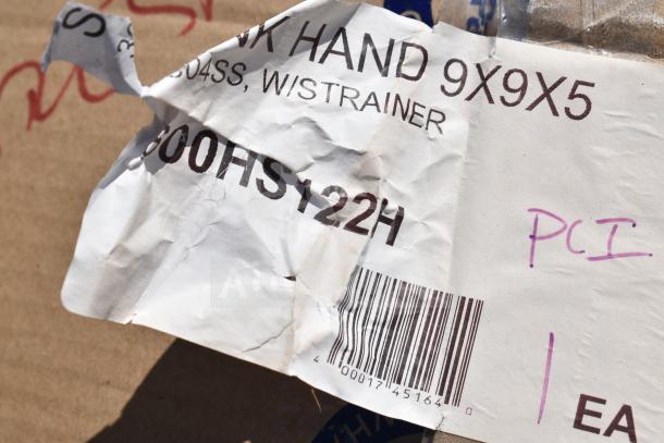 A crumpled product label for a hand sink model 9X9X5, part number 600HS122H, with visible barcode.