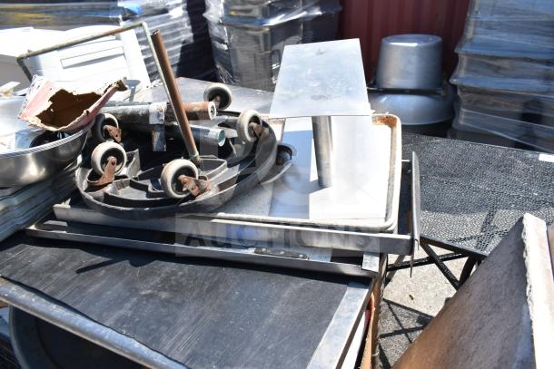 Commercial table with under shelf, includes bus bin lids, chair, and bowl. Features casters and metal components. Visible wear.