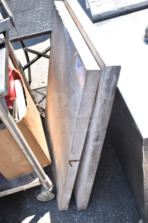 Two large gray stone countertops, stacked vertically. Slight wear visible. Label indicates "2 Times Your Bid."