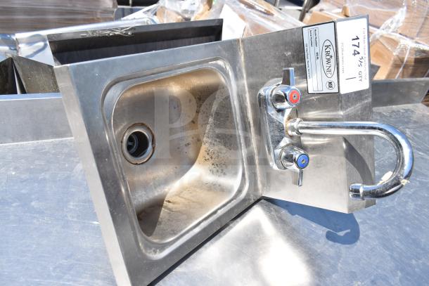 Krowne HS-9L 14 1/4" x 12" wall-mounted stainless steel hand sink with faucet, showing wear and metal finish.