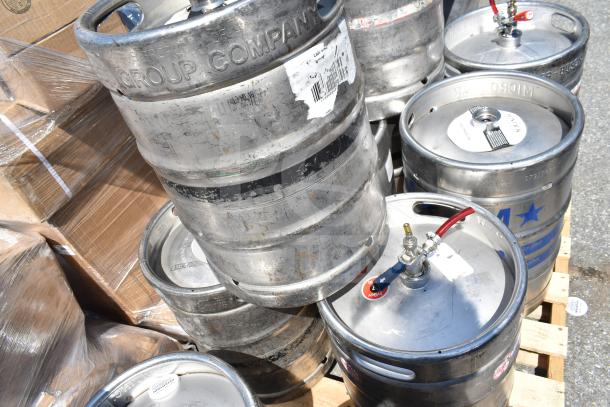 Ten half-size barrel kegs on pallets, displaying "Group Company" markings. Used condition, visible taps and barcodes.