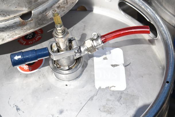 10 half-size barrel kegs with connectors and hoses shown. Visible branding on parts. Used for beverage storage.