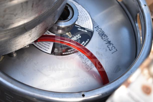 10 half-size barrel kegs featuring Guinness branding, visible markings and red hose, in good condition.