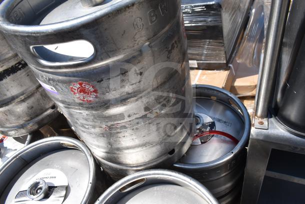 10 half-size metal barrel kegs with visible labels and markings, stacked, showing wear. Auction item promises "10 Times Your Bid!"