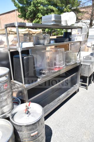 Stainless steel commercial table with two-tier over shelf and under shelf, includes various kitchen containers and pots.