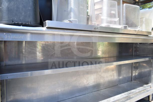 Commercial table with two-tier over shelf and under shelf. Includes various kitchen container contents. L&J NY branded.