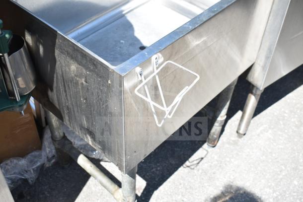 Regency 600IB1824CP commercial ice bin with cold plate, stainless steel, sturdy condition, visible attachment bracket.
