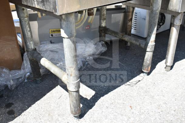 Regency 600IB1824CP Commercial Ice Bin base, visible piping, and labeling, showing structural details and condition.