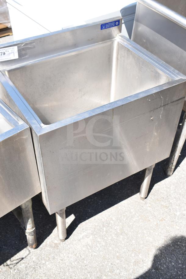 Commercial ice bin, stainless steel, good condition, with visible wear and blue label on top edge.