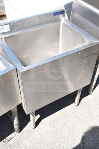 Commercial ice bin, stainless steel, good condition, with visible wear and blue label on top edge.