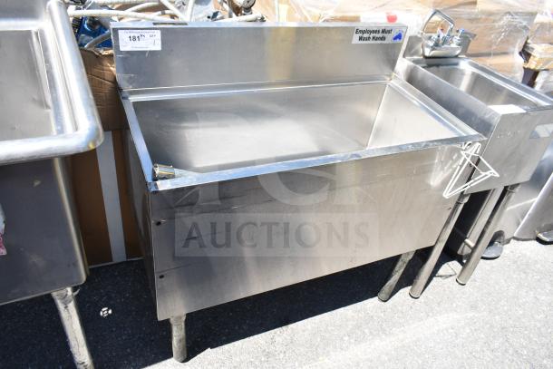 Stainless steel commercial ice bin with cold plate, in good condition. Includes faucet and "Employees Must Wash Hands" label.