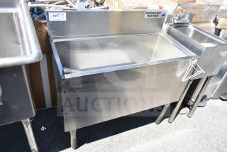 Stainless steel commercial ice bin with cold plate, in good condition. Includes faucet and "Employees Must Wash Hands" label.