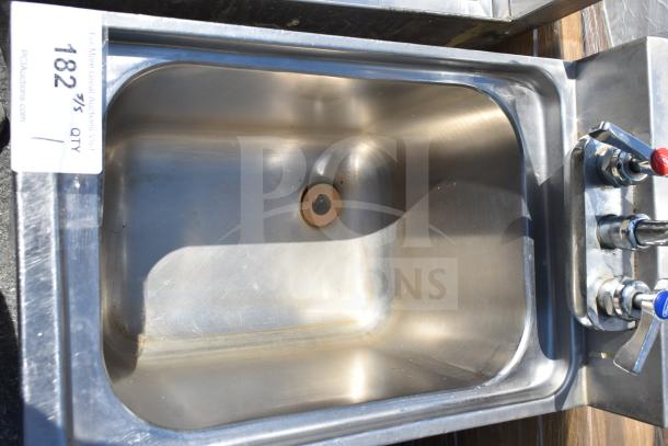 Stainless steel commercial single bay sink with hot and cold taps, in good condition, auction tag 182 visible.