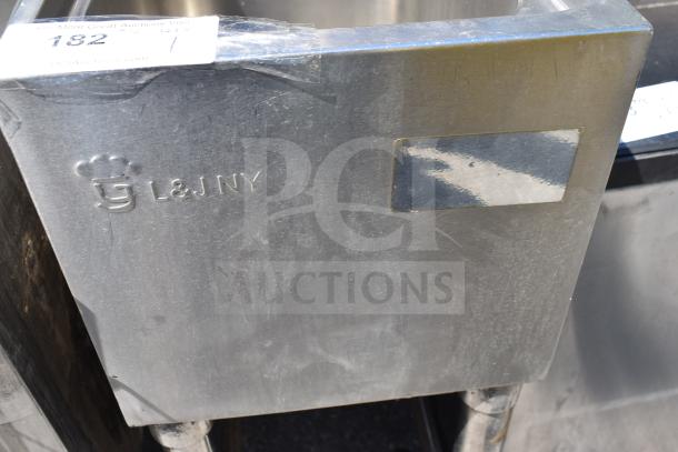 Commercial single bay sink, stainless steel, L&J NY branding visible, with auction label "182" on the side, in used condition.