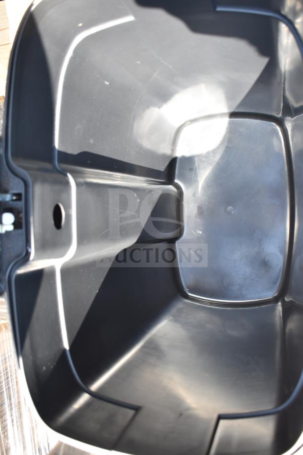 Two metal foot pedal trash cans, interior view, gray color, sturdy construction, suitable for waste disposal.