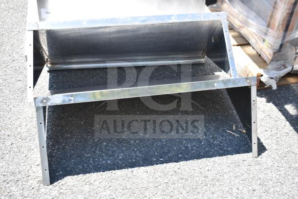 Metal wall mount shelf, two-tier design, sturdy construction. Slight wear visible. Ideal for storage, mounting holes on sides.