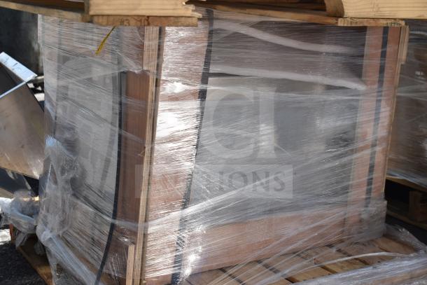 3 brand new scratch and dent items, including an ice bin and wire shelves, wrapped for protection on a wooden pallet.