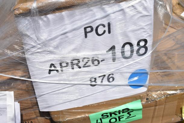Skid containing 12 new scratch and dent items, including cushions and a chair. Marked "PCI APR26-108" and "SKID 4 OF 5".