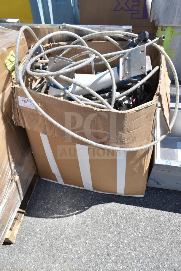 Cardboard box filled with various cables and metal fixtures. Box shows wear. Label marked "188". Miscellaneous lot.