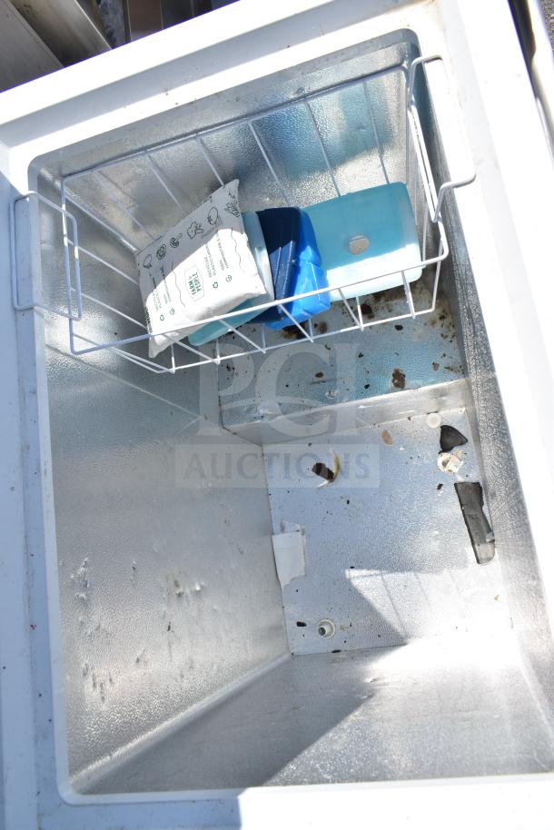 Hotpoint HHM5SMWW chest freezer interior, with storage basket, slight wear. 115 Volts, 1 Phase, suitable for home use.