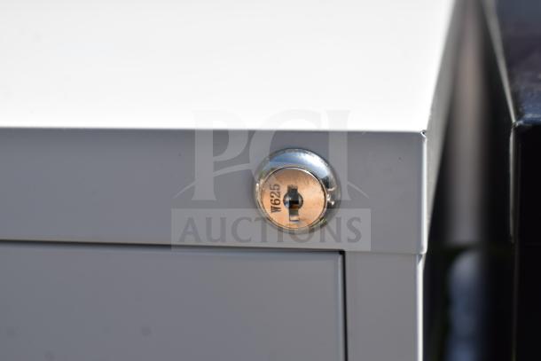 Hirsh 17892 black four-drawer file cabinet lock detail with marking "W625." New condition, 15" x 22" x 52".