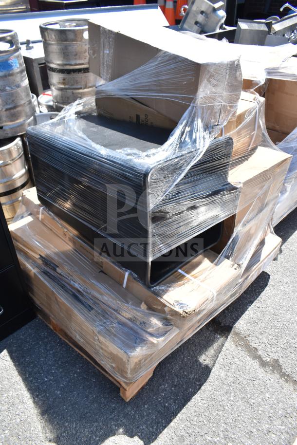 Packaged items including a cart, trash can, and folding table, shrink-wrapped on a pallet, scratch and dent condition.