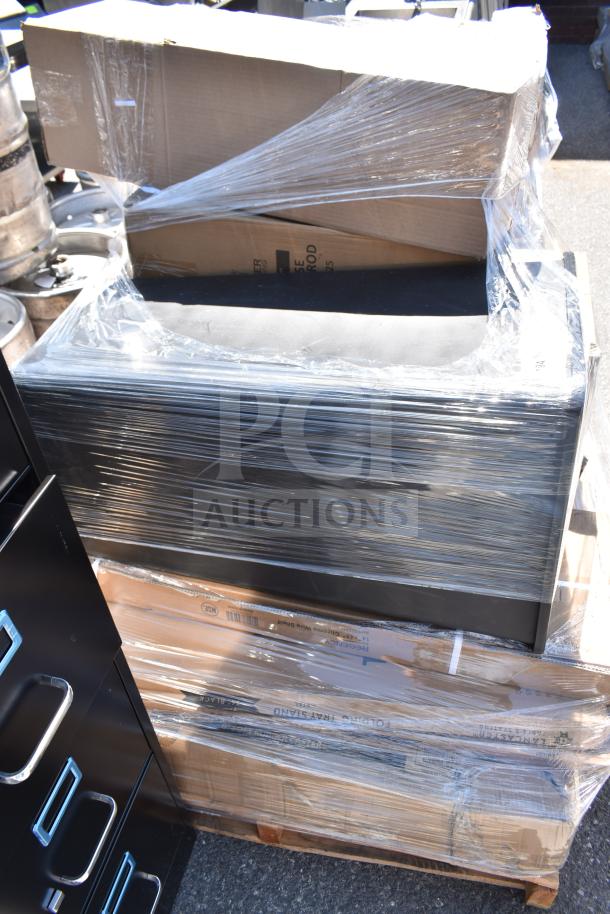 Stack of eight brand new items, including cart, trash can, and folding table, wrapped in plastic. Visible packaging and labels.