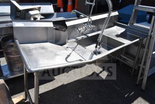 Stainless steel clean and dirty side dish tables; dual sinks, pre-rinse faucet, good condition, sturdy construction.