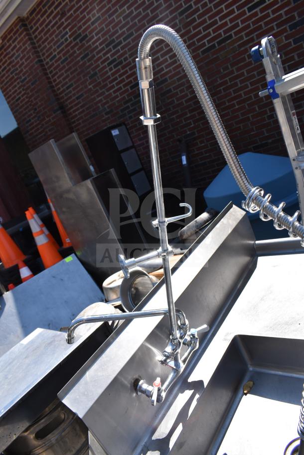 Stainless steel dish table with backsplash, commercial grade faucet, includes clean and dirty side sections, used condition.