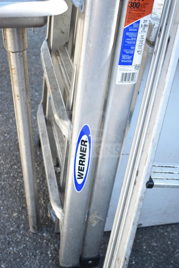 Werner ladders, aluminum, weight capacity 300 lbs, model MT-22, 21 ft, extendable, visible brand and safety labels.