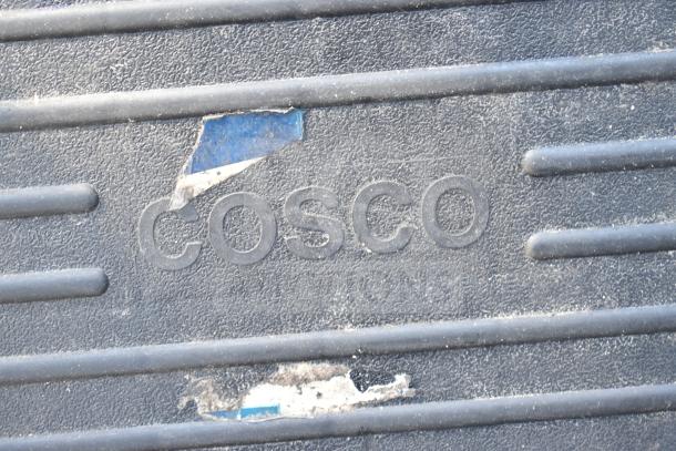 Two Cosco ladders with textured rungs and visible wear. Ideal for home or work use. Bid includes both ladders.