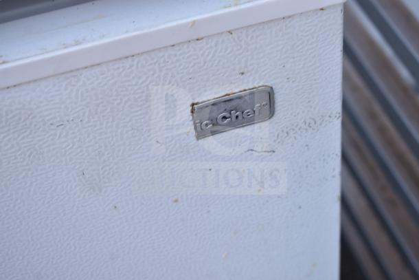 2 Magic Chef HMCF5W4 chest freezers, 115 volts, 1 phase, textured white exterior, visible brand label, slight wear.