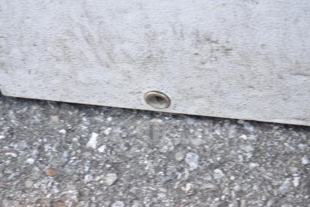 Magic Chef HMCF5W4 chest freezer, visible drainage port, textured exterior, 115 volts, 1 phase.